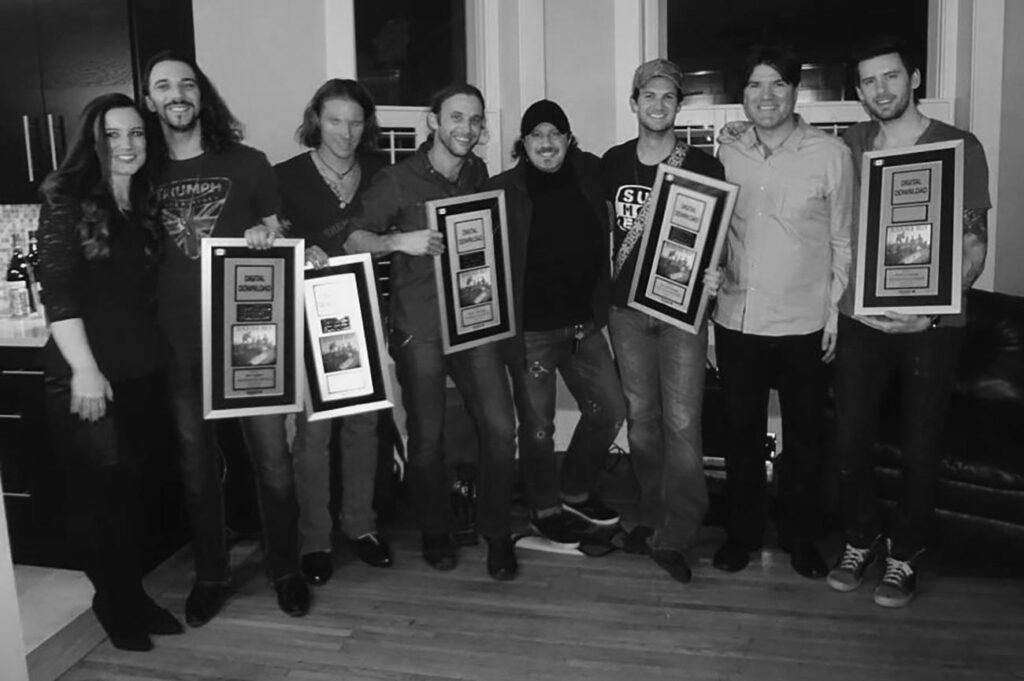 Blackjack Billy receiving their Canadian Platinum records for their song The Booze Cruise